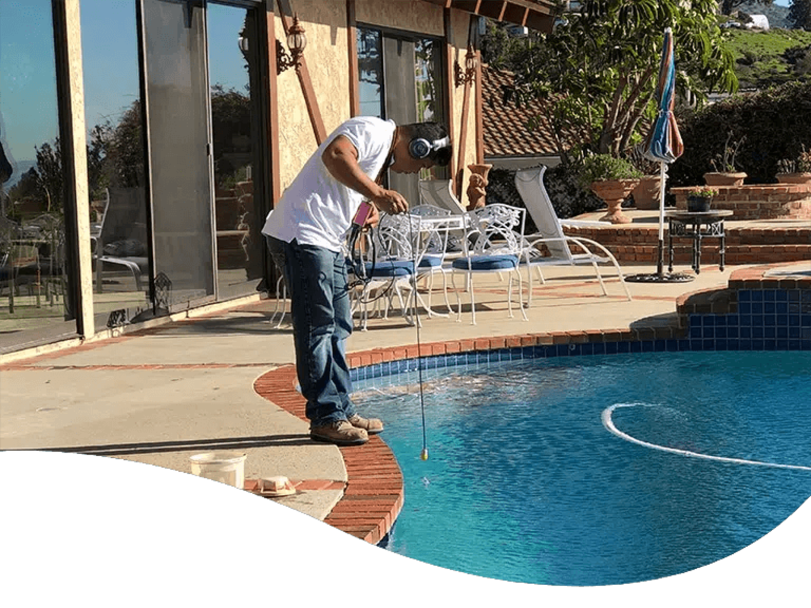 Pool Pirates' LeakTronics technician working on pool leak