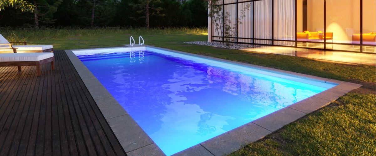 Your new beautiful pool lit up at night.