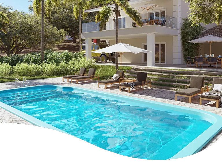 Two people swimming in their backyard swimming pool.